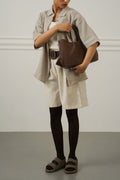 CREAM BELTED PLEAT SHORTS