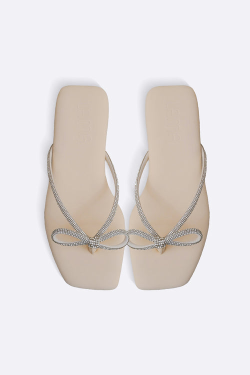 CREAM BOW FLIP FLOPS