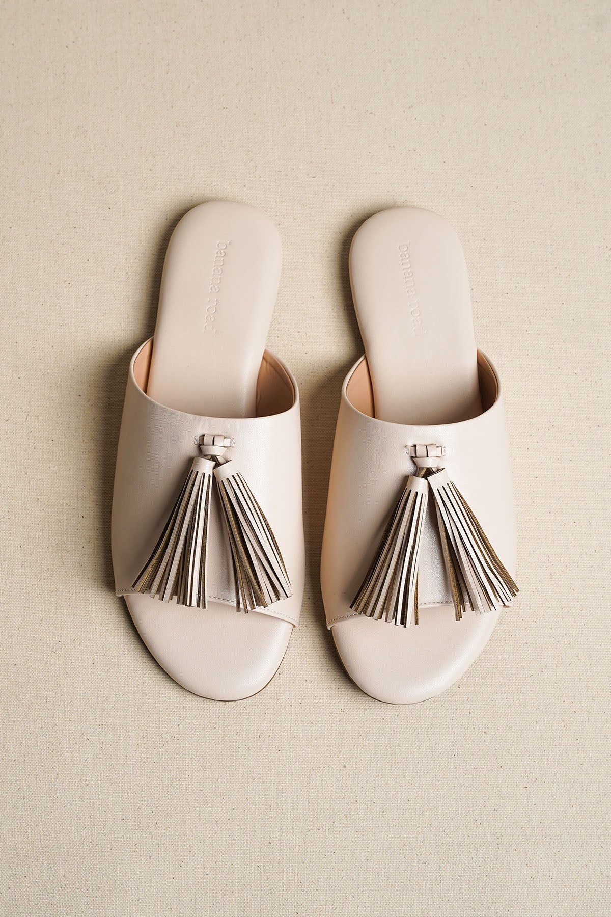 OFF WHITE TROPIC TASSEL SLIDES